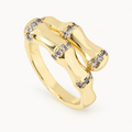A gold-tone ring with bamboo-inspired lines and clear stone accents — studio view | Jeweliano