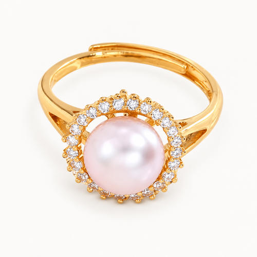 A gold-tone ring with a pale pink pearl-like centre surrounded by clear stones — studio view | Jeweliano